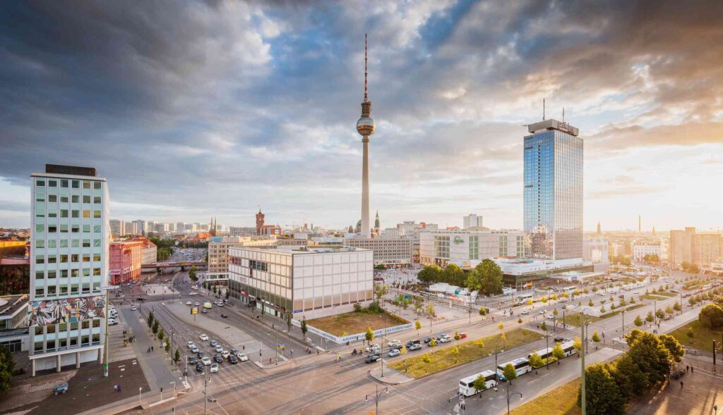 A stunning view of Alexanderplatz with the iconic Fernsehturm towering in the background, a symbol of modern Berlin