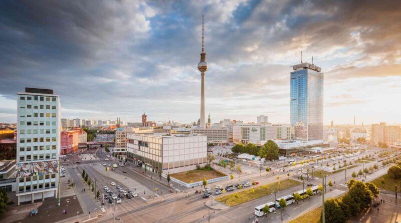 A stunning view of Alexanderplatz with the iconic Fernsehturm towering in the background, a symbol of modern Berlin
