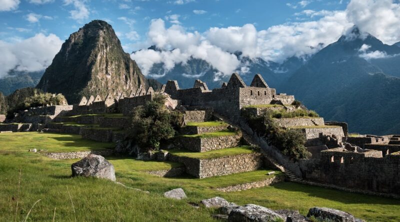 Machu Picchu ruins with Huayna Picchu in the background during sunrise